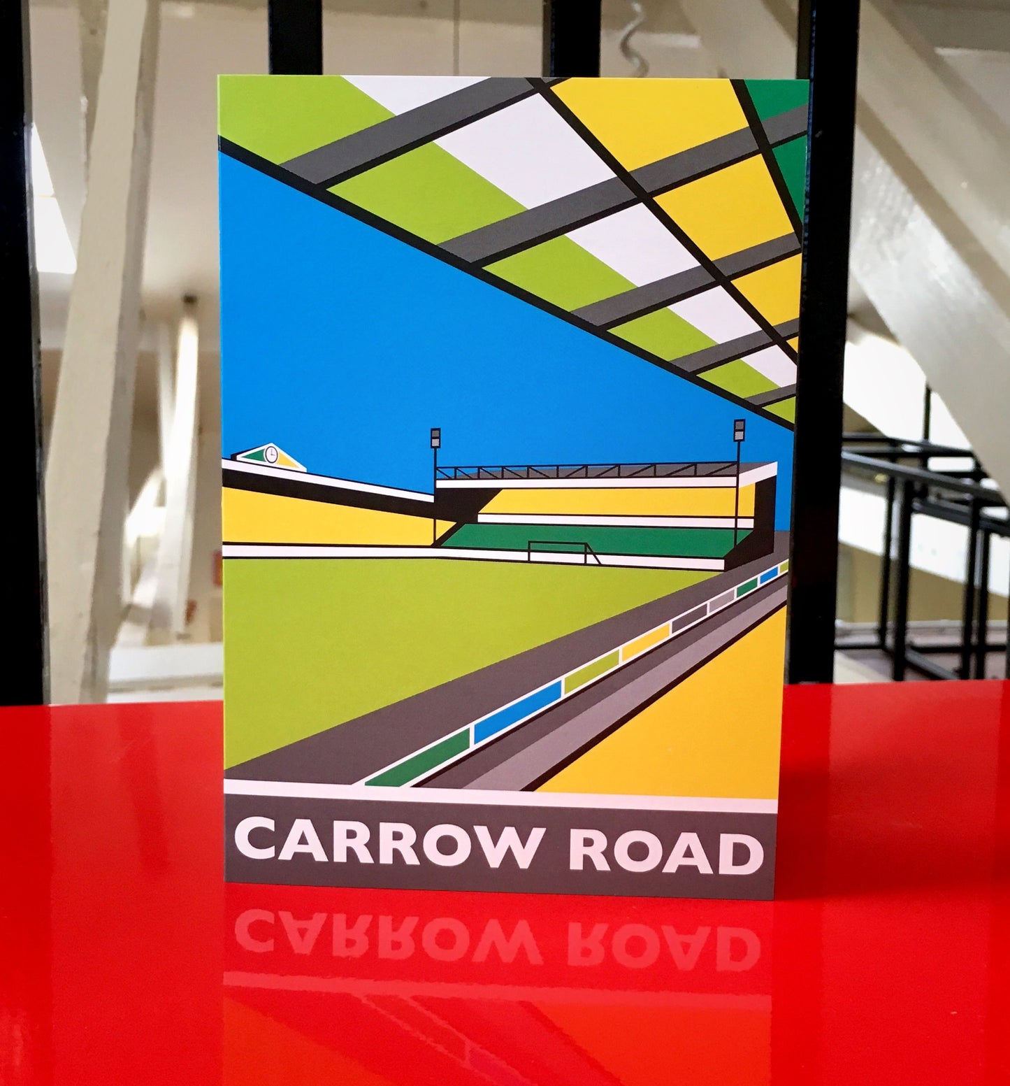 CARROW Road Travel Poster Style Greetings Card by Rebecca Pymar